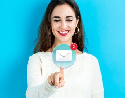 Woman Smiling at Email Icon